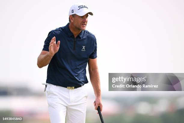 Robert Karlsson of Sweden acknowledges the crowd after a putt on the second green during the third round of the KitchenAid Senior PGA Championship at...