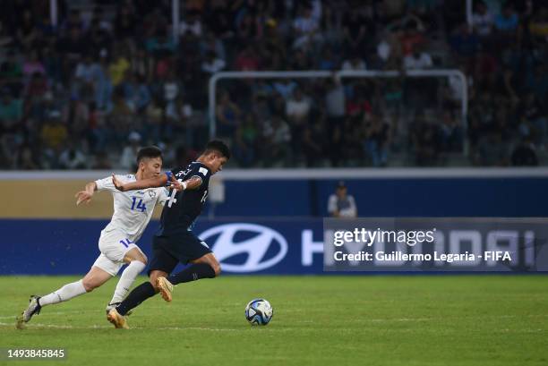 Jonathan Franco of Guatemala competes for the ball with Abbosbek Fayzullaev of Uzbekistan during the FIFA U-20 World Cup Argentina 2023 Group B match...