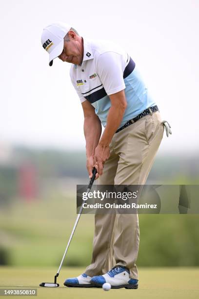 Adilson da Silva of Brazil putts on the second green during the third round of the KitchenAid Senior PGA Championship at Fields Ranch East at PGA...