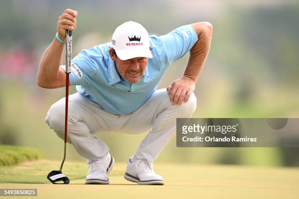 Alex Cejka of Germany lines up a putt on the second green during the third round of the KitchenAid Senior PGA Championship at Fields Ranch East at...