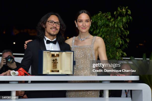 Director Pham Thien An poses with The Caméra d’or Award for 'Inside The Yellow Cocoon Shell' and President of the Camera d’Or Jury Anaïs Demoustier...