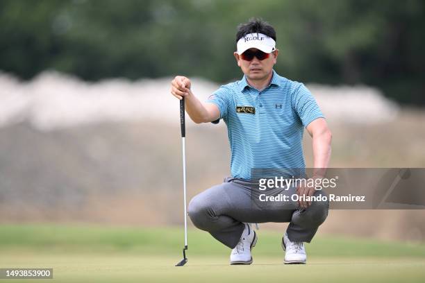 Yang of South Korea lines up a putt on the fourth green during the third round of the KitchenAid Senior PGA Championship at Fields Ranch East at PGA...