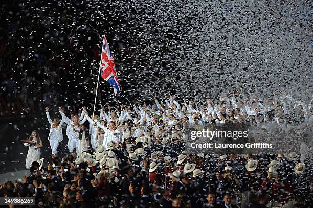 Sir Chris Hoy of the Great Britain Olympic cycling team carries his country's flag during the Opening Ceremony of the London 2012 Olympic Games at...