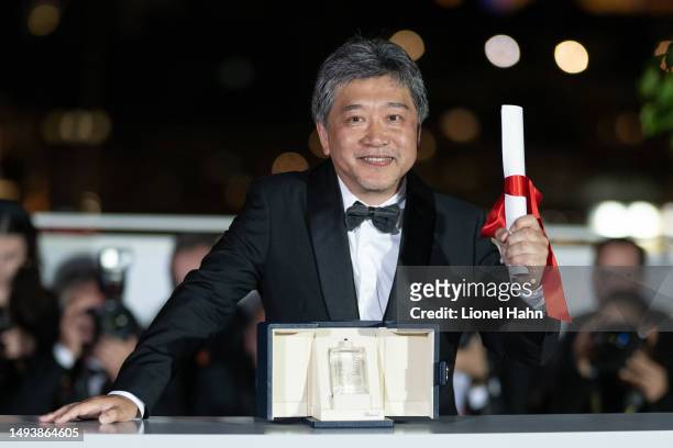 Hirokazu Kore-eda poses with the The Award for Best Screenplay for 'Kaibutsu' during the Palme D'Or winners photocall at the 76th annual Cannes film...