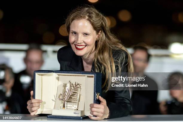 Justine Triet poses with The Palme D'Or Award for 'Anatomy of a Fall' during the Palme D'Or winners photocall at the 76th annual Cannes film festival...