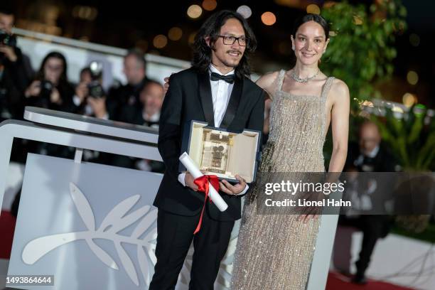 Director Pham Thien An poses with The Caméra d’or Award for 'Inside The Yellow Cocoon Shell' and President of the Camera d’Or Jury Anaïs Demoustier...