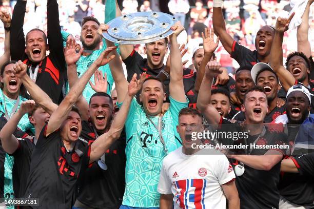 Manuel Neuer of FC Bayern Munich lifts the Bundesliga Meisterschale trophy after the team's victory in the Bundesliga match between 1. FC Köln and FC...