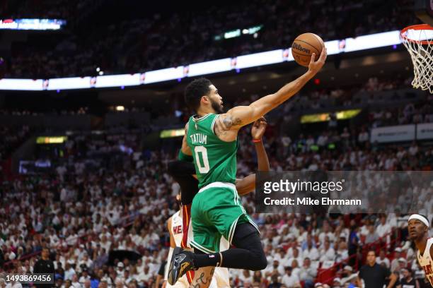 Jayson Tatum of the Boston Celtics drives to the net against Bam Adebayo of the Miami Heat during the first quarter in game six of the Eastern...