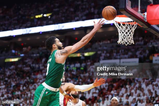 Jayson Tatum of the Boston Celtics drives to the net ahead of Max Strus of the Miami Heat during the second quarter in game six of the Eastern...
