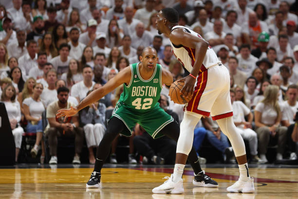 Bam Adebayo of the Miami Heat controls the ball ahead of Al Horford of the Boston Celtics during the second quarter in game six of the Eastern...
