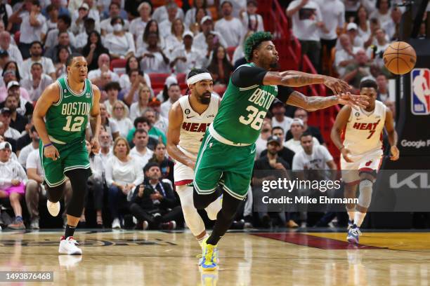 Marcus Smart of the Boston Celtics dishes a pass against the Miami Heat during the second quarter in game six of the Eastern Conference Finals at...