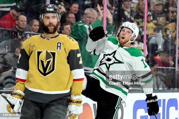 Ty Dellandrea of the Dallas Stars celebrates after scoring a goal against the Vegas Golden Knights as Alex Pietrangelo reacts during the third period...
