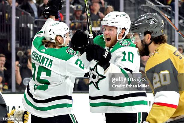 Ty Dellandrea of the Dallas Stars celebrates with Joel Kiviranta after scoring his second goal against the Vegas Golden Knights during the third...