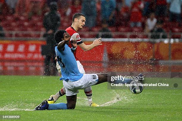 Thomas Vermaelen of Arsenal FC in action with Boyata of Manchester City during the pre-season Asian Tour friendly match between Arsenal and...