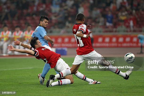 Aguero of Manchester City fires a shot during the pre-season Asian Tour friendly match between Arsenal and Manchester City at Birds Nest Stadium on...