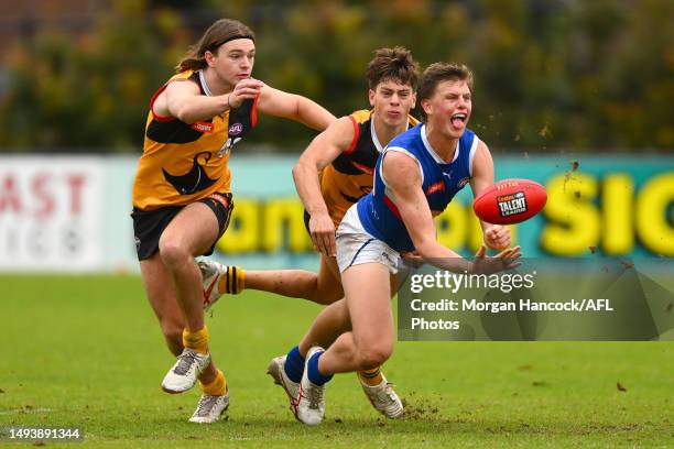 Kade De La Rue of the Stingrays tackles Josh Smillie of the Ranges during the round eight Coates Talent League match between Dandenong Stingrays and...