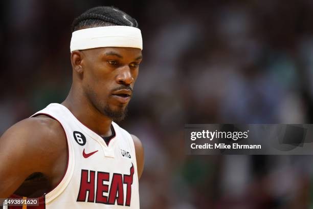 Jimmy Butler of the Miami Heat looks on against the Boston Celtics during the fourth quarter in game six of the Eastern Conference Finals at Kaseya...