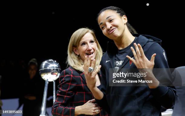 Kiah Stokes of the Las Vegas Aces poses with her championship ring as WNBA Commissioner Cathy Engelbert looks on during a 2022 WNBA championship ring...