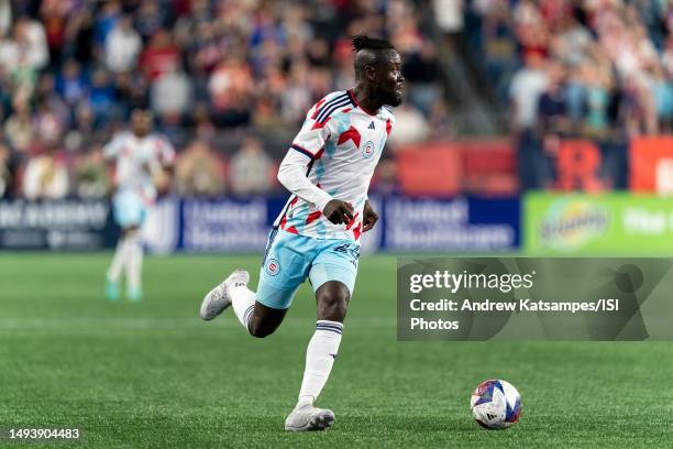 Kei Kamara of Chicago Fire FC dribbles down the wing during a game between Chicago Fire FC and New England Revolution at Gillette Stadium on May 27,...