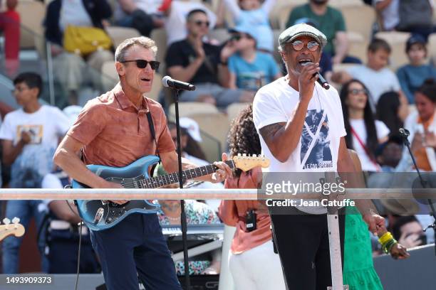 Yannick Noah performs his songs - here with Mats Wilander on the guitar, finalist in 1983 - during a special concert on Central Court to celebrate...