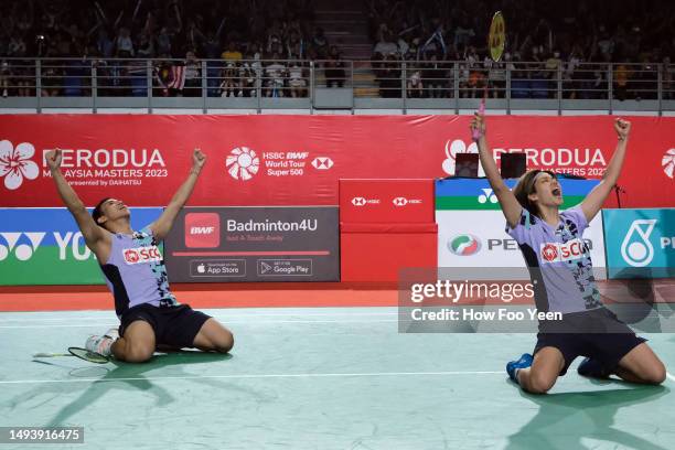 Dechapol Puavaranukroh and Sapsiree Taerattanachai of Thailand celebrate after defeating Feng Yan Zhe and Huang Dong Ping of China in the mix doubles...