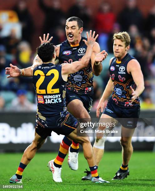 Taylor Walker of the Crows celebrates a goal with Izak Rankine of the Crows during the round 11 AFL match between Adelaide Crows and Brisbane Lions...