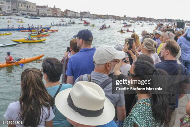 Tourists and locals watch the start of the 47th Vogalonga Regatta at San Marco Basin on May 28, 2023 in Venice, Italy.