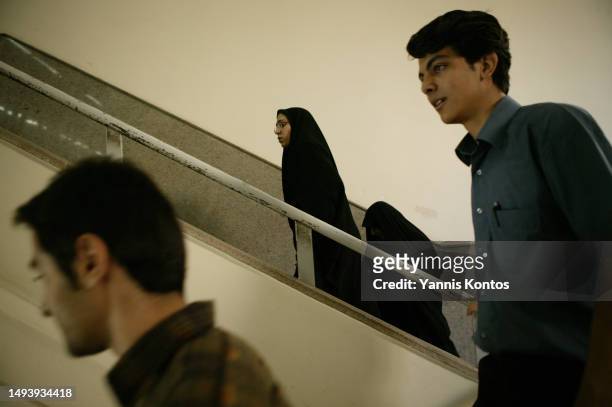 Iranian Students walk through the Faculty of Engineering in the University of Tehran, May 30, 2005.