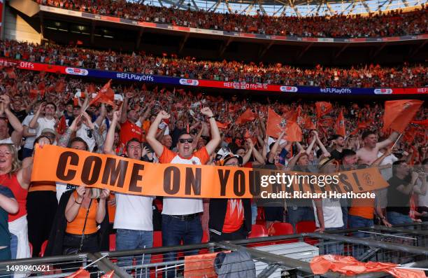 Luton Town fans enjoy the atmosphere as Luton win promotion to the Premier League in the Sky Bet Championship Play-Off Final between Coventry City...