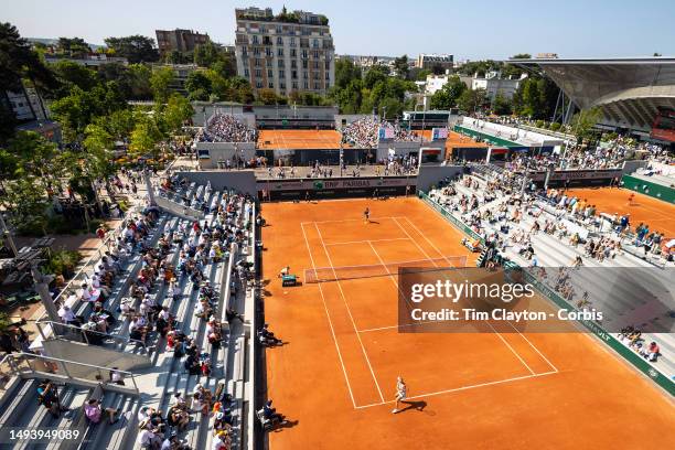 General view of Magdalena Frech of Poland in action against Shuai Zhang of China in the first round of the singles competition on Court Seven during...