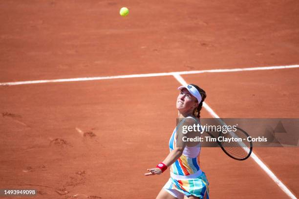 Magdalena Frech of Poland in action against Shuai Zhang of China in the first round of the singles competition on Court Seven during the 2023 French...