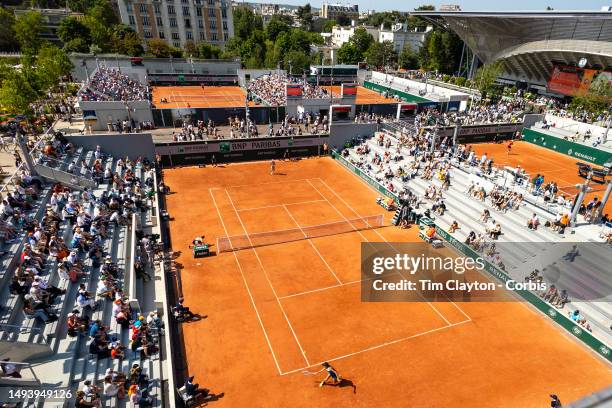 General view of Magdalena Frech of Poland in action against Shuai Zhang of China in the first round of the singles competition on Court Seven during...