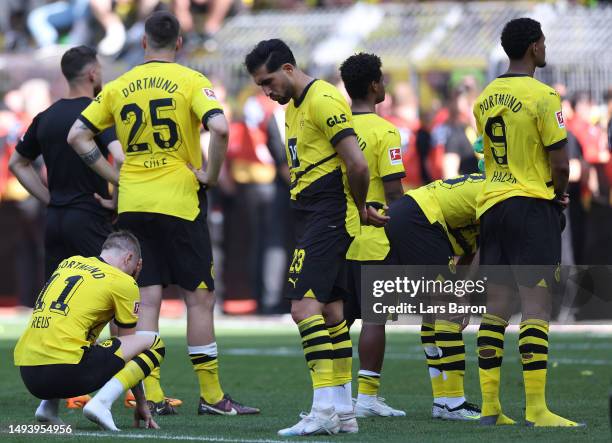 Borussia Dortmund players look dejected following the team's draw, as they finish second in the Bundesliga behind FC Bayern Munich during the...