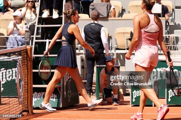 Marta Kostyuk of Ukraine walks past Aryna Sabalenka after their Women's Singles First Round Match on Day One of the at Roland Garros on May 28, 2023...