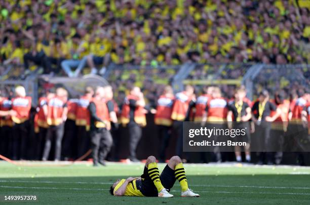 Mats Hummels of Borussia Dortmund looks dejected following the team's draw, as they finish second in the Bundesliga behind FC Bayern Munich during...