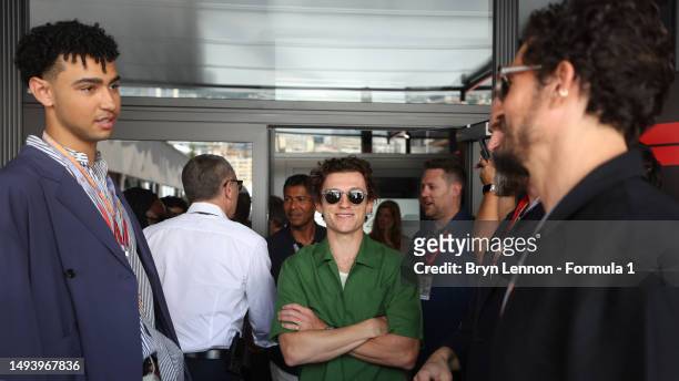 Archie Madekwe, Tom Holland, David Harbour and Orlando Bloom talk in the Paddock during the F1 Grand Prix of Monaco at Circuit de Monaco on May 28,...