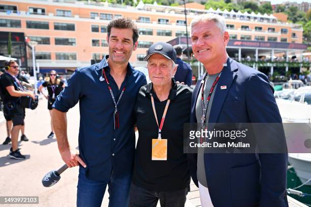 Mark Webber, Michael Douglas and David Coulthard pose for a photo in the Paddock prior to the F1 Grand Prix of Monaco at Circuit de Monaco on May 28,...