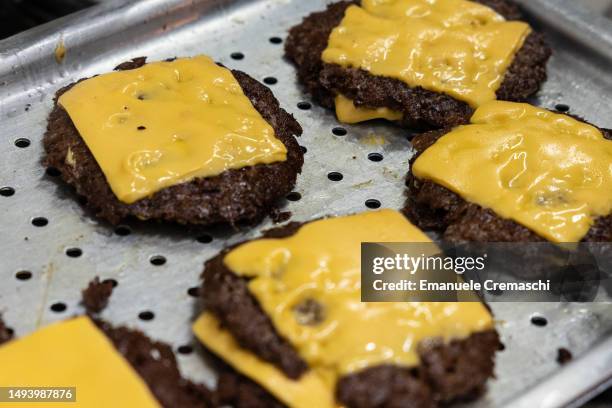 General picture shows grilled cheeseburgers at Meat Crew fast food restaurant on May 28, 2023 in Milan, Italy. On occasion of the World Burger Day,...