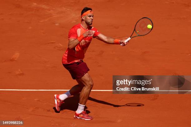 Jiri Vesely of Czech Republic plays a forehand against Stefanos Tsitsipas of Greece during their Men's Singles First Round Match on Day One of the...