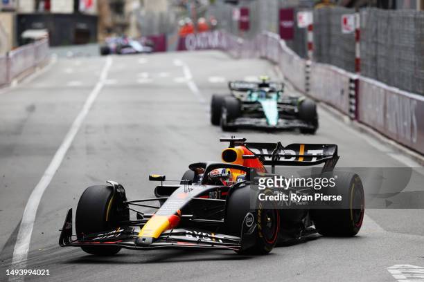 Max Verstappen of the Netherlands driving the Oracle Red Bull Racing RB19 leads Fernando Alonso of Spain driving the Aston Martin AMR23 Mercedes on...