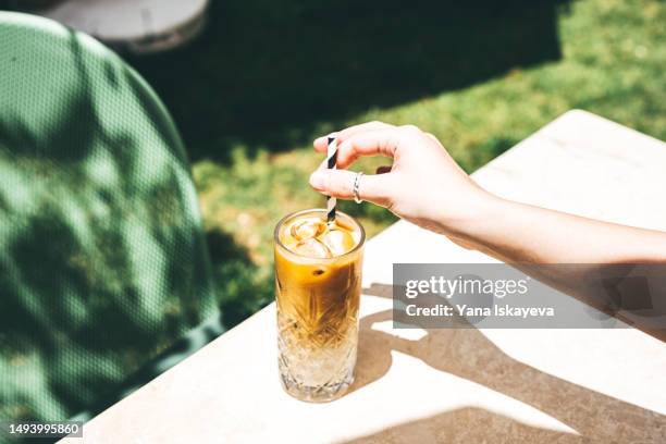 cold and refreshing summer coffee drink - enjoying coffee cafe morning light stock pictures, royalty-free photos & images