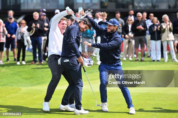 Matteo Manassero of Italy celebrate with same Italy Players after his last putt on the 18th hole during Day Four of the Copenhagen Challenge...