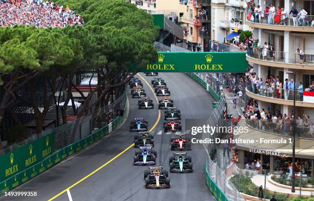 Max Verstappen of the Netherlands driving the Oracle Red Bull Racing RB19 leads Fernando Alonso of Spain driving the Aston Martin AMR23 Mercedes and...