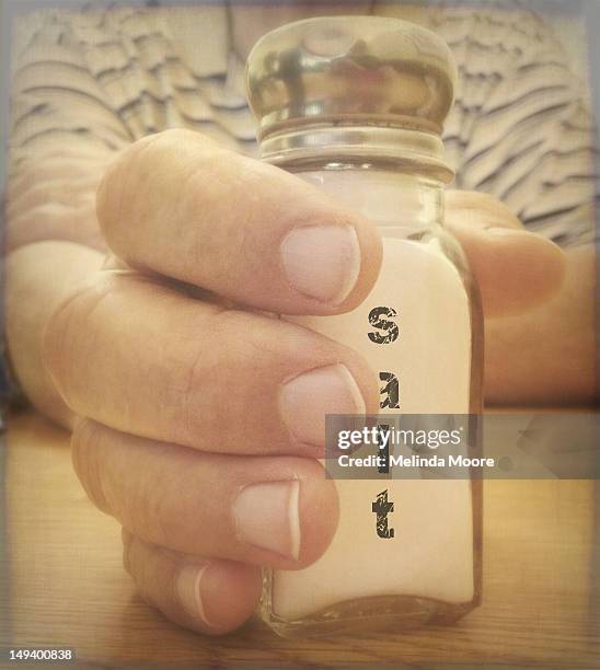 Hand Using Salt Shaker Hand And Salt Shaker Photos and Premium High Res Pictures - Getty Images