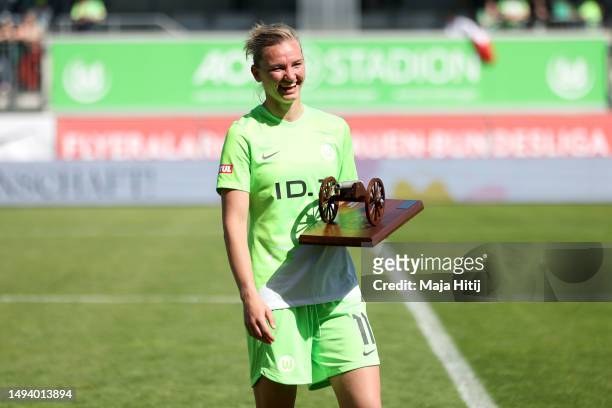Alexandra Popp of VfL Wolfsburg poses for a photo with the top goalscorer of the season award following the FLYERALARM Frauen-Bundesliga match...