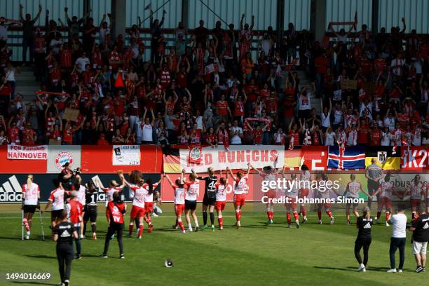 Bayern Munich celebrate with fans following their sides victory in the FLYERALARM Frauen-Bundesliga after the FLYERALARM Frauen-Bundesliga match...