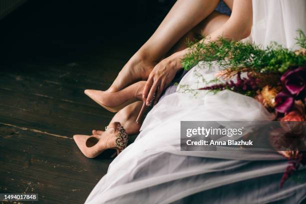 bridal bunch of flowers and shoes with high heels. concept of preparation for wedding. - wedding shoes stock pictures, royalty-free photos & images