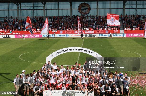 Players of FC Bayern München Women and FC Bayern München celebrate prior to lifting the FLYERALARM Frauen-Bundesliga trophy after their sides victory...