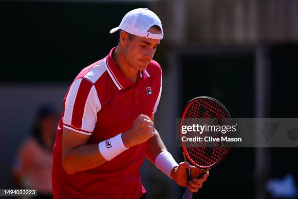 John Isner of United States celebrates a point against Nuno Borges of Portugal during their Men's Singles First Round match on Day One of the 2023...