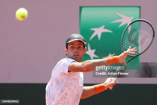 Facundo Diaz Acosta of Argentina plays a forehand against Jason Kubler of Australia during their Men's Singles First Round match on Day One of the...